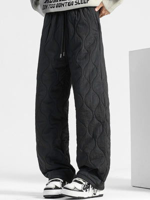 Black quilted sweatpants with relaxed fit and drawstring waist.