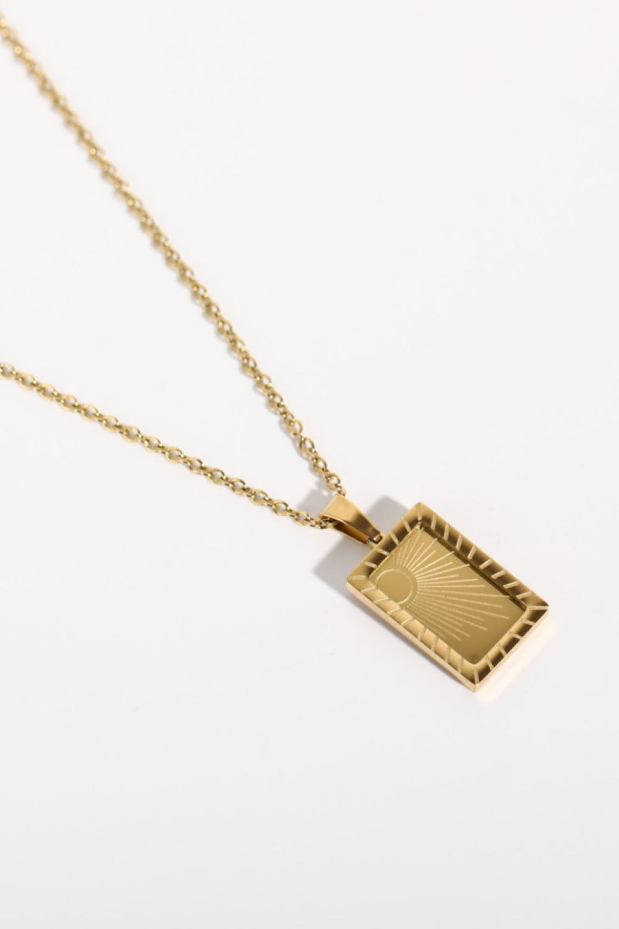 18K gold-plated rectangular pendant necklace with sunburst detail in Sun color.