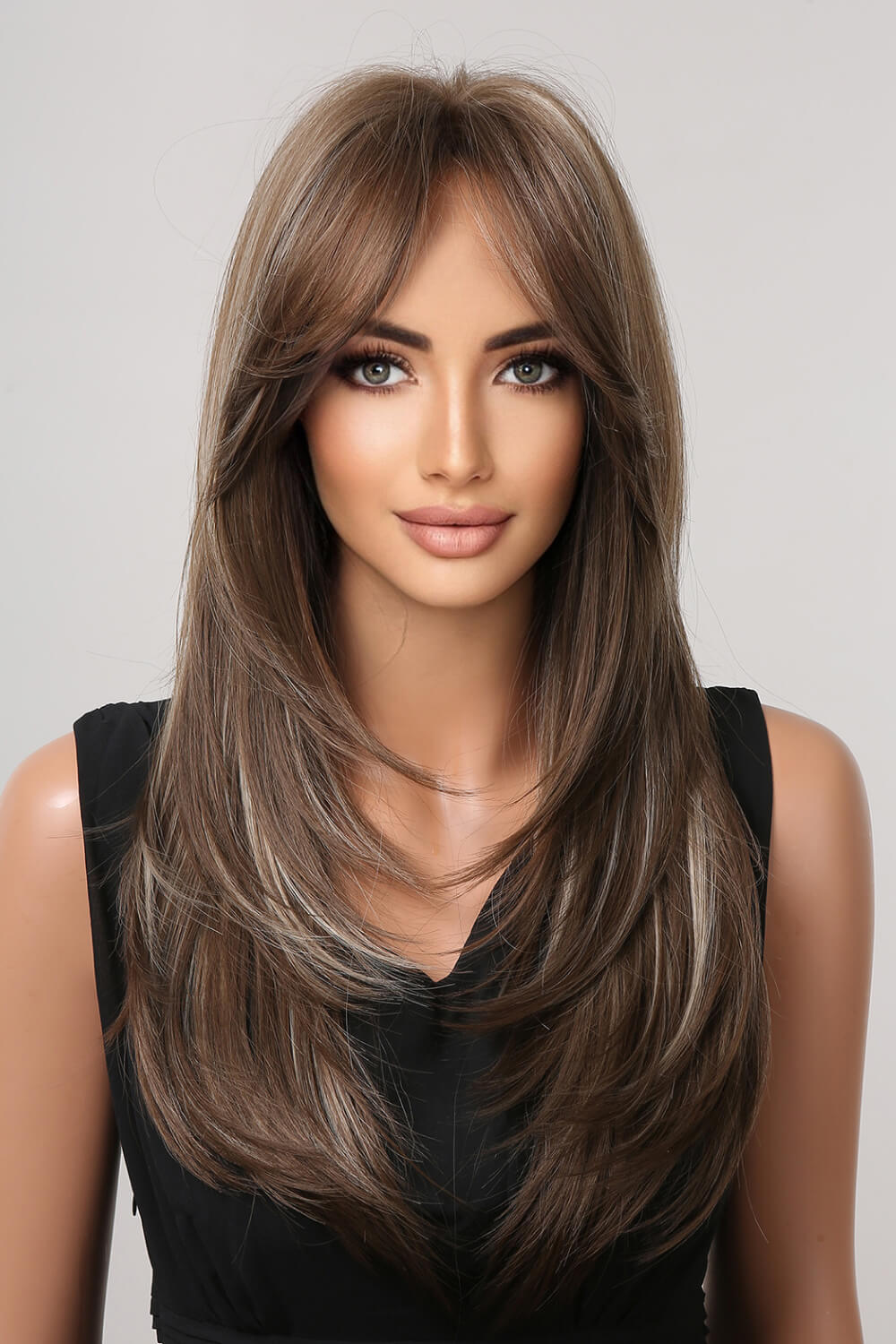Layered contour synthetic wig with bangs in brown and blonde highlights