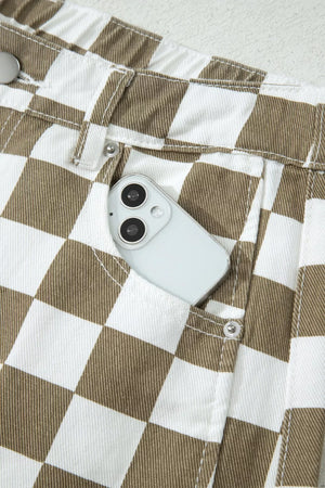 Chic checkered denim barrel pants in brown and white with a phone in the pocket.