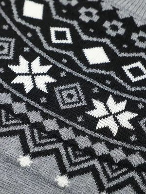 Knit sweater with black, white, and grey fair isle pattern featuring snowflakes and diamonds.