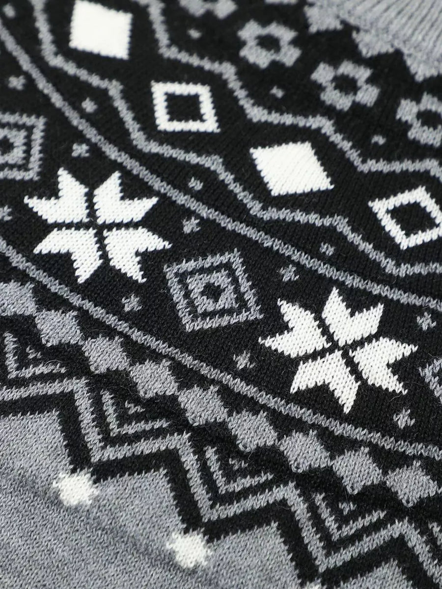 Knit sweater with black, white, and grey fair isle pattern featuring snowflakes and diamonds.