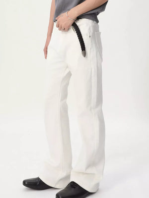White relaxed fit bootcut men's jeans with a black braided belt.