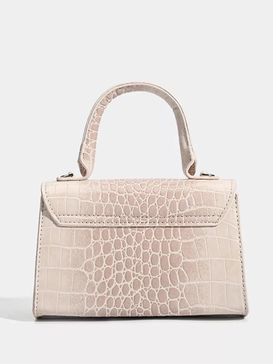 Off-white croc-embossed small tote bag with silver hardware and top handle.