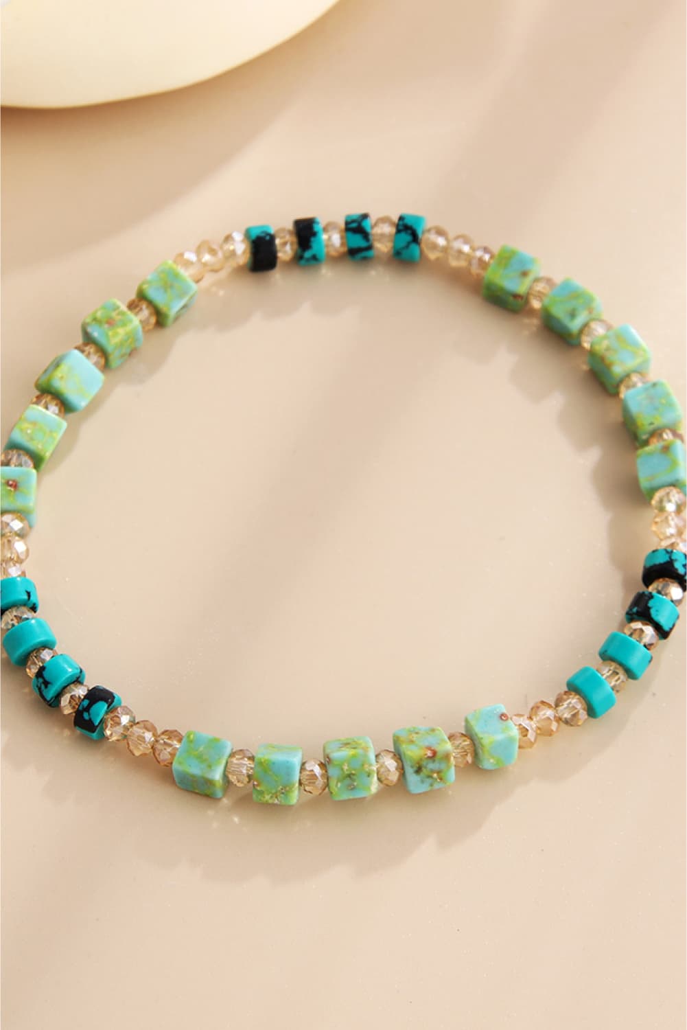 Turquoise cube and crystal beaded bracelet with teal and black accents