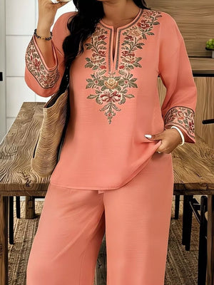 Peach embroidered tunic with wide sleeves and matching wide-leg pants.