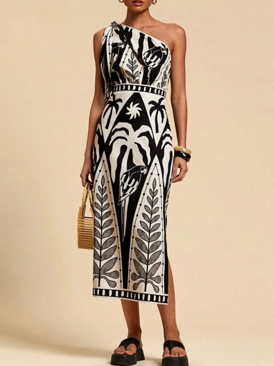 Tropical print one-shoulder midi dress in black and white with a defined waist and side slit.
