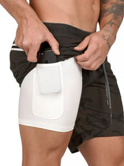 Dual-layer performance shorts in Army Green camouflage with white built-in liner and phone pocket.
