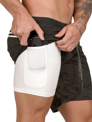 Dual-layer performance shorts in Army Green camouflage with white built-in liner and phone pocket.