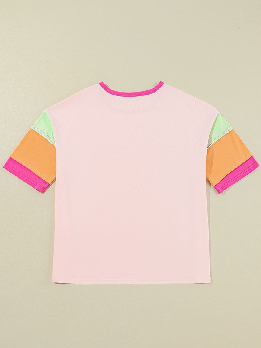 Colorblock tee in watermelon pink with colorblocked sleeves in orange, light green, and pink.