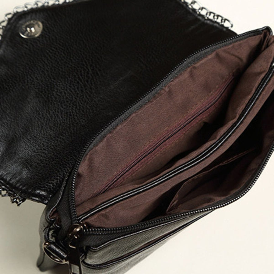 Black crossbody bag with flap and crocodile-print