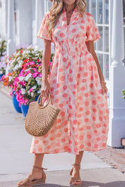 Puff sleeve midi dress in white with pink polka dots, smocked waist, and zip front.