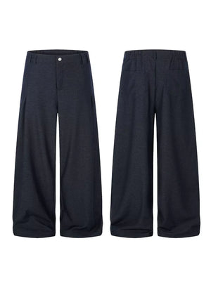 Relaxed fit dark heathered sweatpants with wide legs and front pleats.
