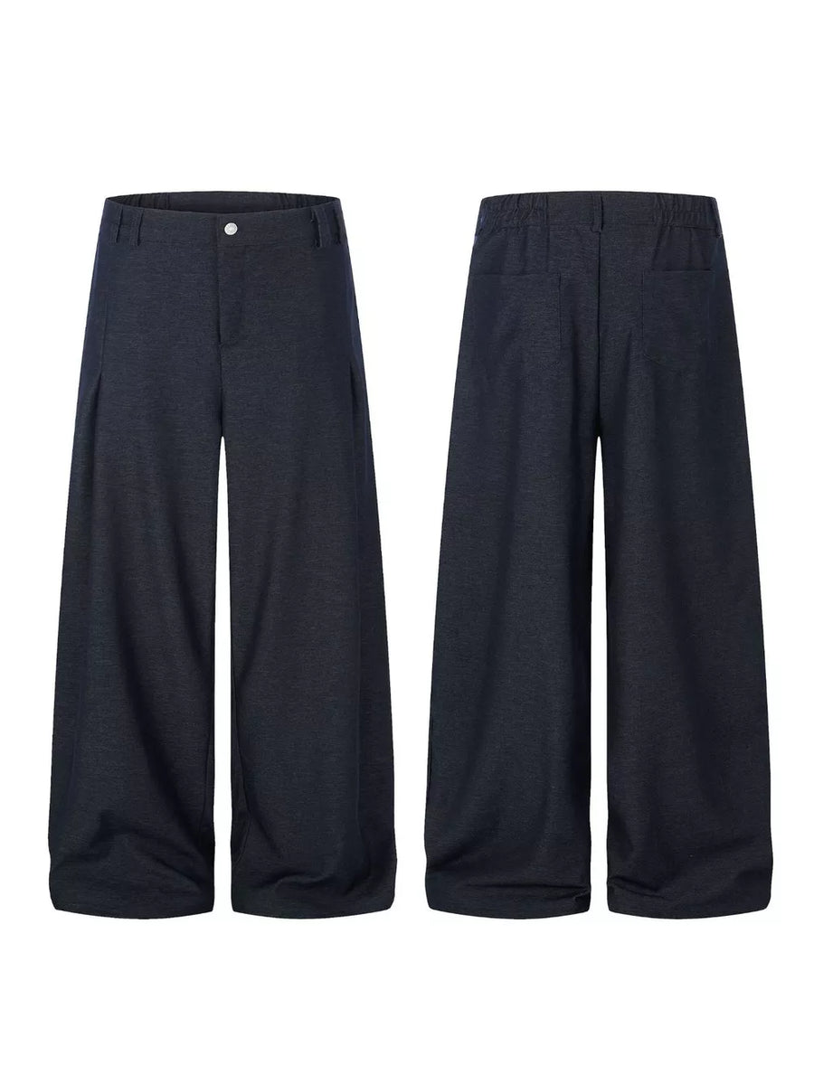 Relaxed fit dark heathered sweatpants with wide legs and front pleats.