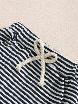 Children's navy and white striped cotton sweatshirt and pants set with rope drawstring detail.