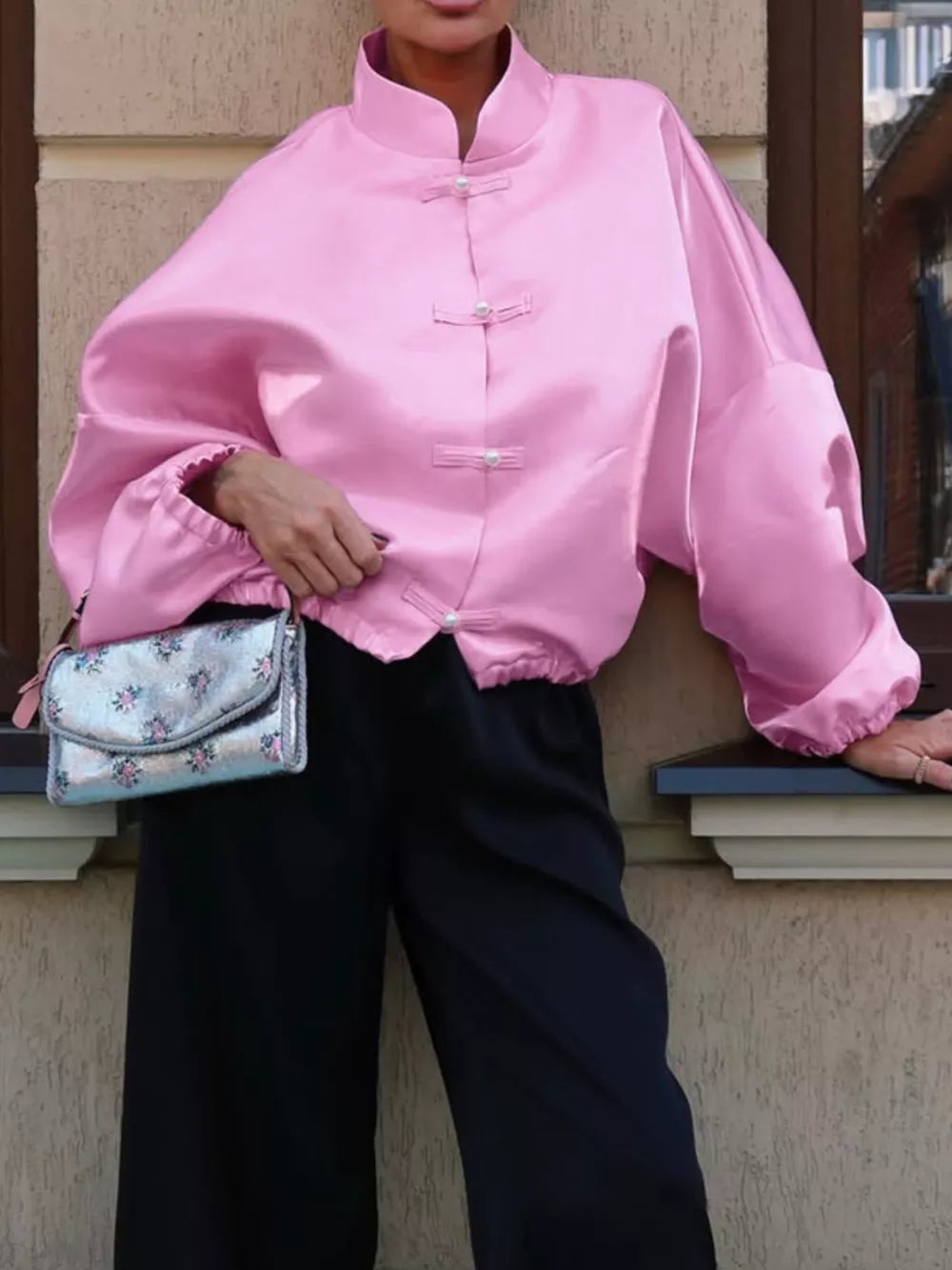 button-up shirt in pink featuring buttoned and oversized fit