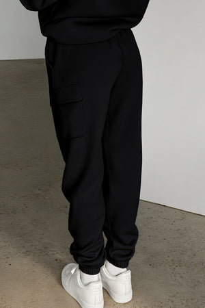 Black cargo pocketed relaxed joggers with cuffed ankles.