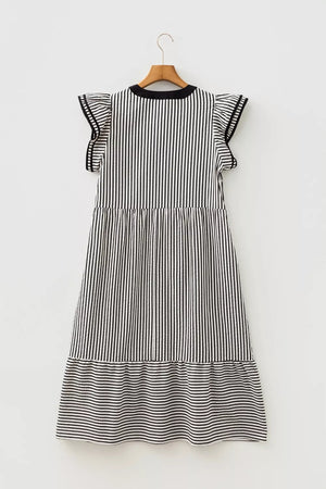 Black and white striped tiered midi dress with ruffle sleeves and pockets.