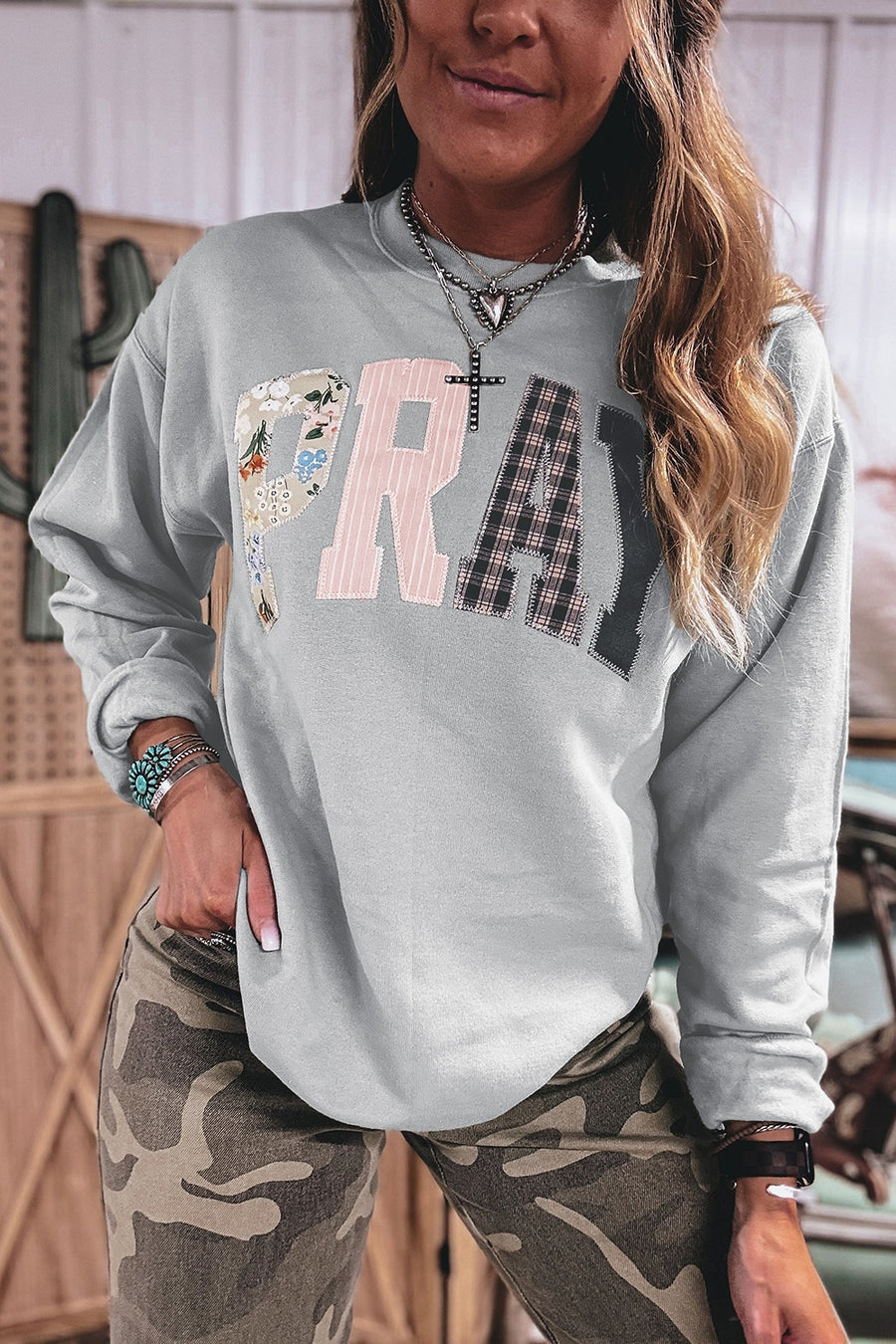light grey pullover sweater with patchwork and crew neck