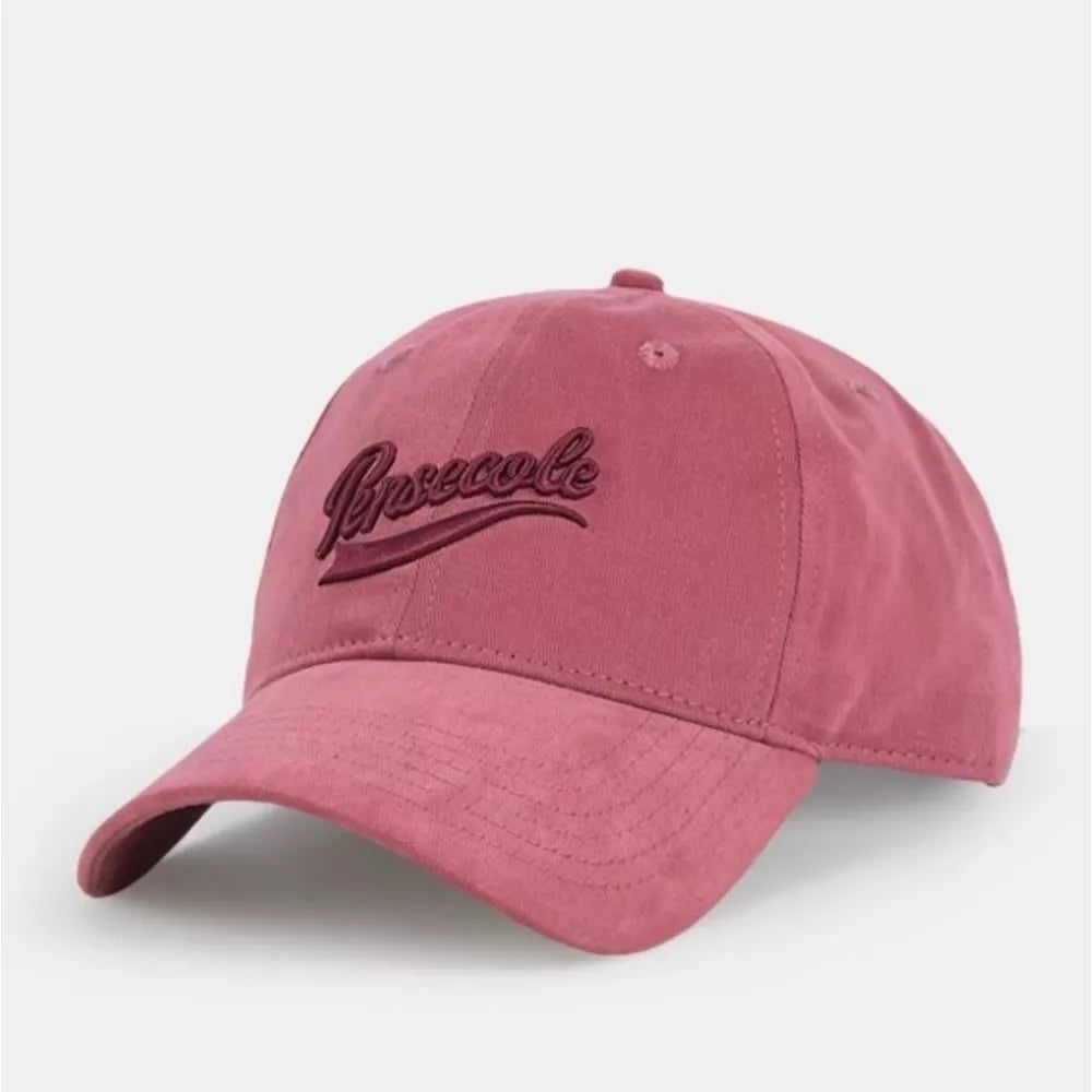 Vintage washed cotton baseball cap in Raspberry Powder with embroidered text.