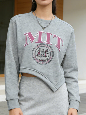 Grey asymmetrical cropped sweatshirt with MIT graphic and crew neck.