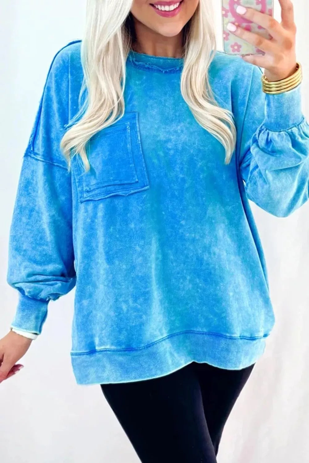 80% cotton, 20% polyester Care instructions: Machine wash cold sweatshirt in aqua blue with oversized silhouette