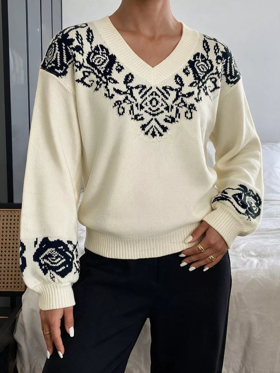 black pullover sweater featuring dropped shoulder and floral