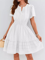 White textured V-neck tiered dress with smocked waist and short sleeves