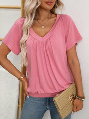 Pink ruched V-neck t-shirt with banded hem and short sleeves.