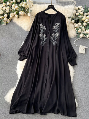 Black embroidered floral maxi dress with tie neck and long sleeves