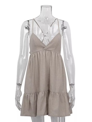Beige linen blend mini dress with spaghetti straps, V-neck, and tiered ruffle hem