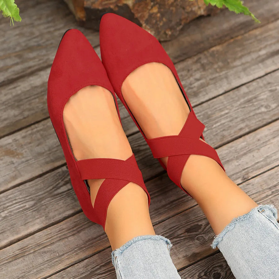 Deep Red crisscross strap pointed-toe ballet flats with elastic straps.