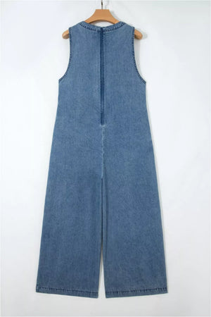 Denim jumpsuit with V-neck, sleeveless, wide leg, and back zipper detail.