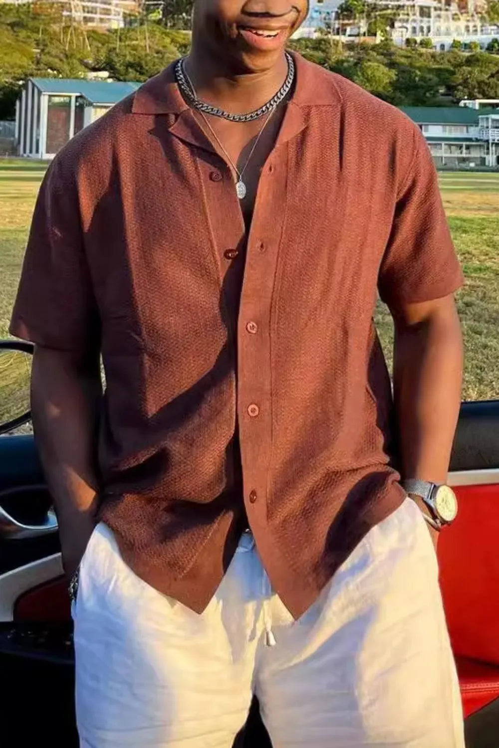 Textured Cuban collar short sleeve shirt in terracotta brown with button front.