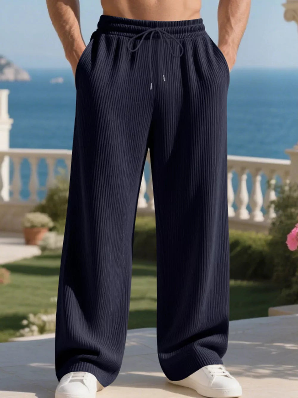 Navy blue ribbed drawstring sweatpants with relaxed fit and wide leg.