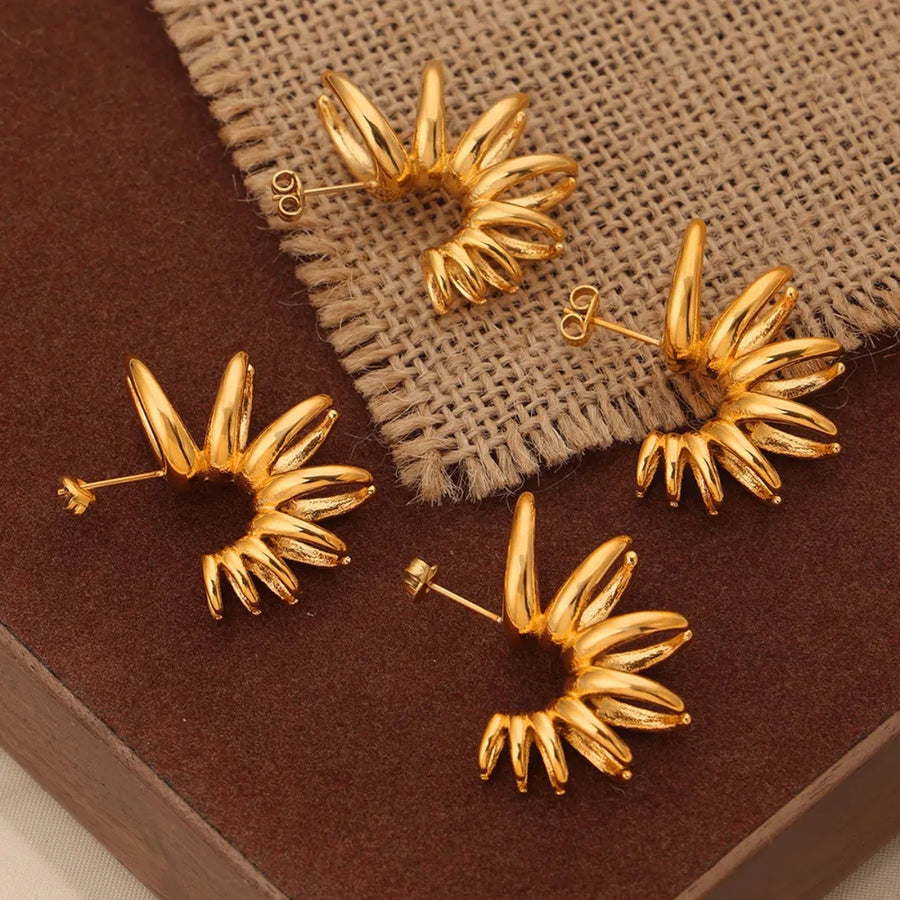 Gold sculptural petal drop earrings with unique spiral detail