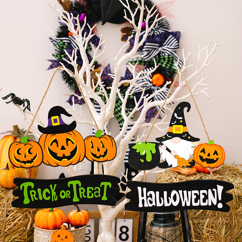 Halloween Sign Trio with pumpkins, witch gnome, and cauldron decor.