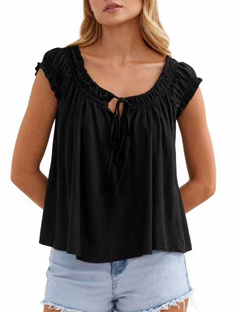 Black tie-front gathered blouse with short ruffled sleeves and a drawstring neckline.