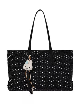 handbag in black with polka dot and shoulder straps