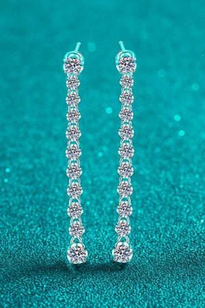 Silver linear drop earrings with multiple round moissanite stones cascading down.
