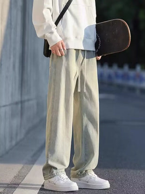 Oversized drawstring jeans in light tan with a loose fit and casual styling.