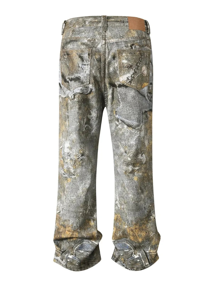 Distressed treasure print wide leg jeans in gray denim with distressed details and pocket embellishments.