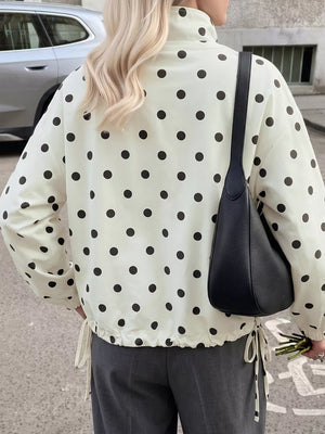 cream windbreaker with hip-length and button-front