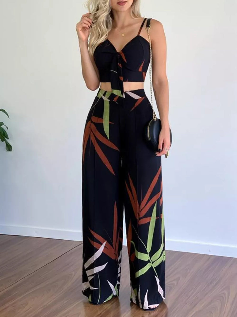 Black tropical print crop top with tie-front and wide-leg pants set.
