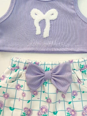 Lavender ribbed tank top with white bow detail and floral grid print shorts with lavender bow