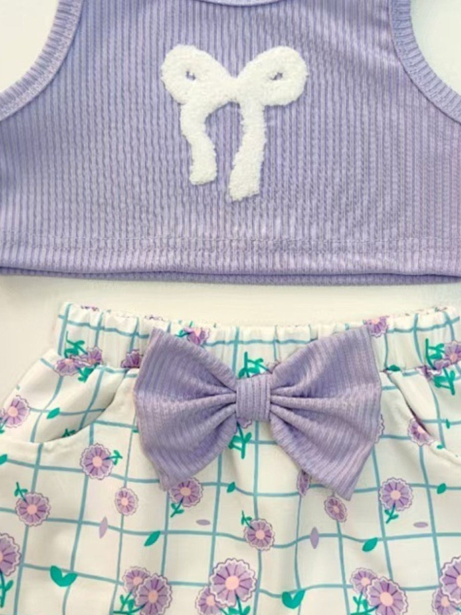 Lavender ribbed tank top with white bow detail and floral grid print shorts with lavender bow