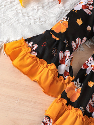 fit-and-flare dress in orange with turkey print and ruffled