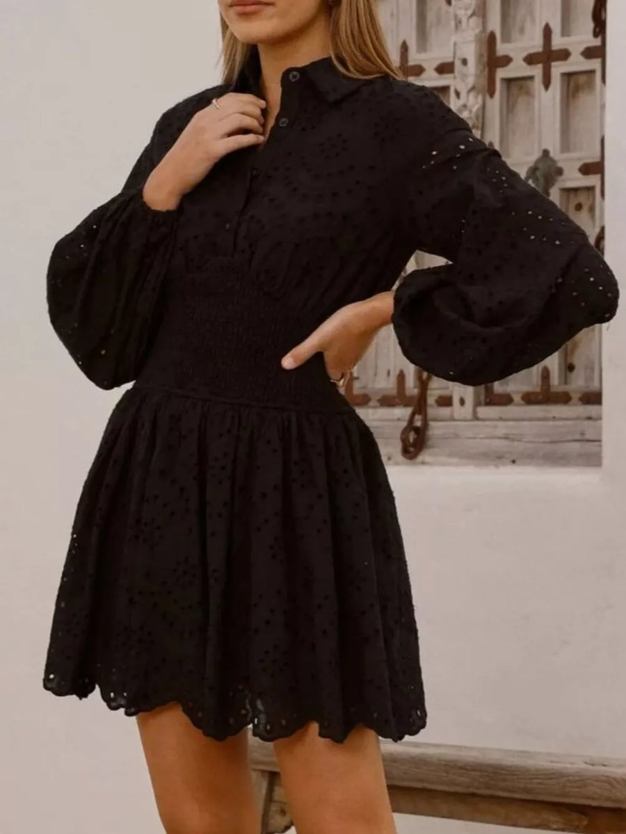 Black eyelet mini dress with balloon sleeves and smocked waist