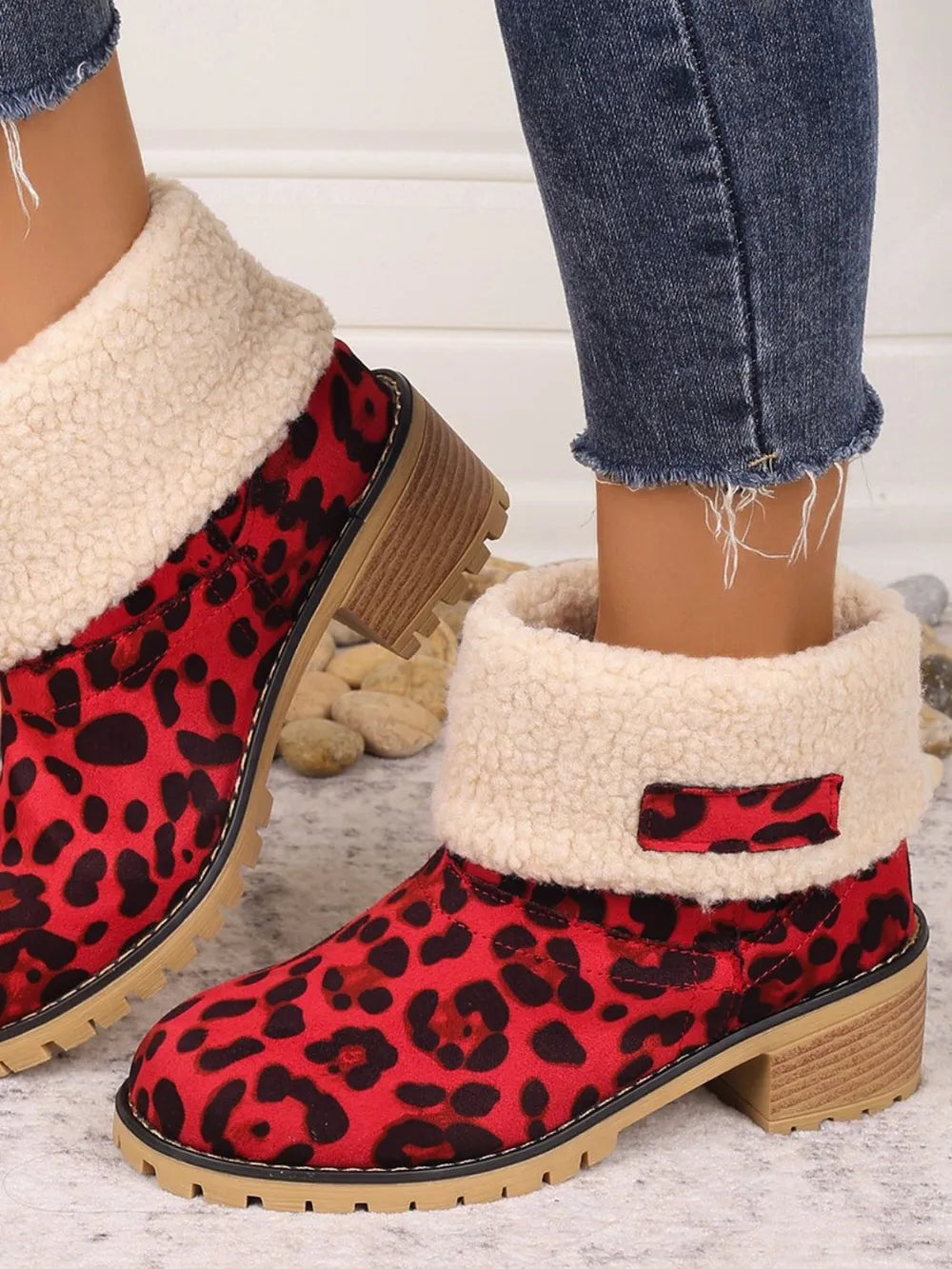 Red leopard print sherpa cuff booties with a chunky heel.