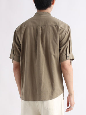 Men's olive band collar short sleeve button-down shirt with rolled cuffs.